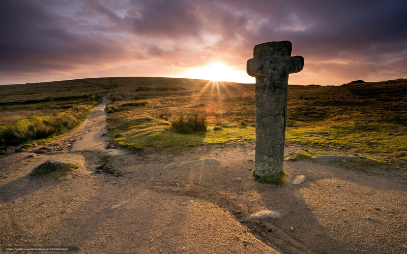 Sunset at a stone cross