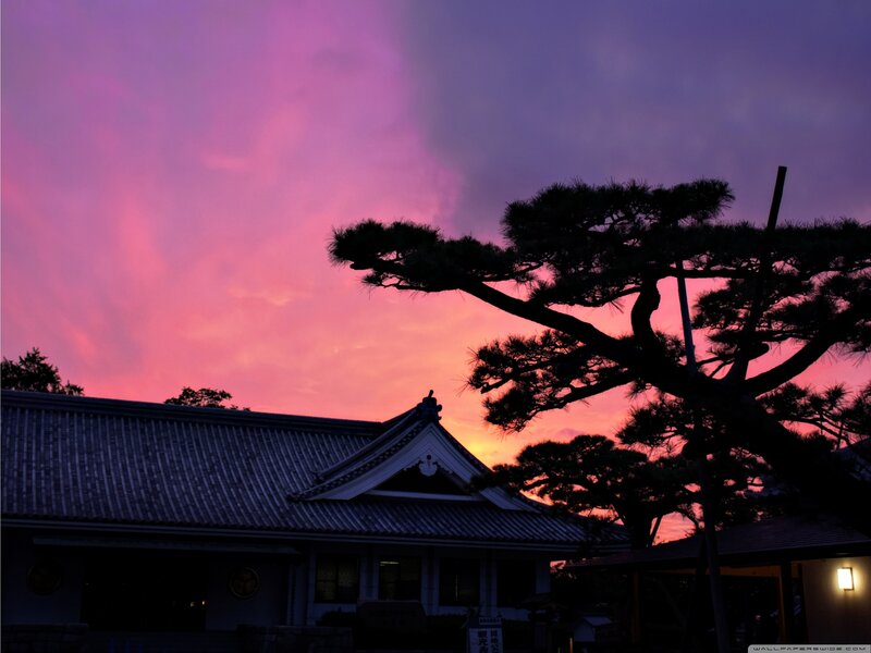 sunset at a traditional japanese building