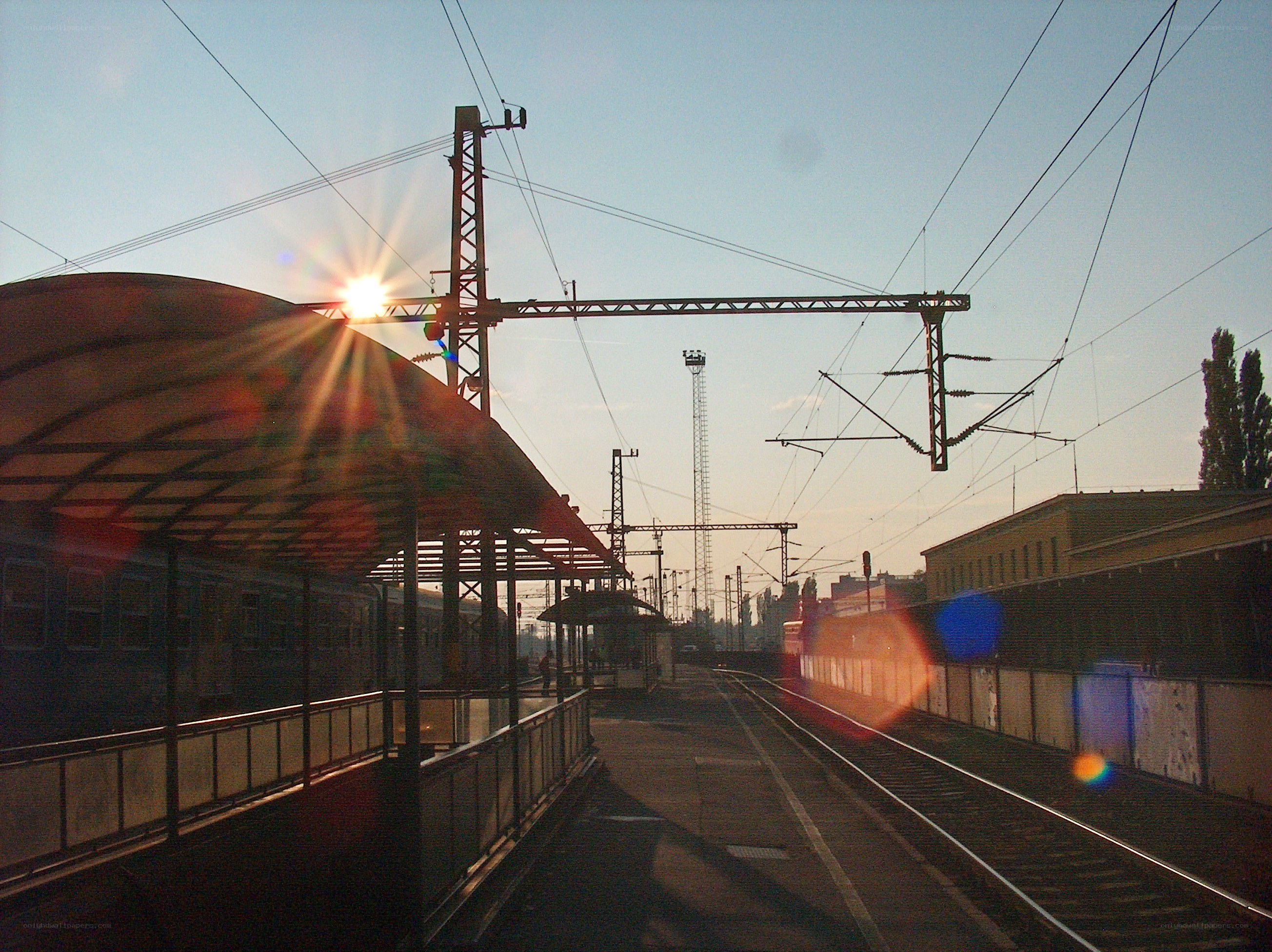 Sunset at a train station