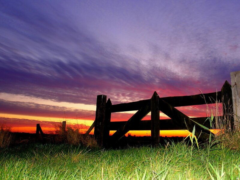 Sunset at a wooden gate