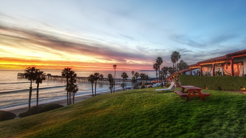 Sunset at Beach Pier — Green, Serene, Photograph