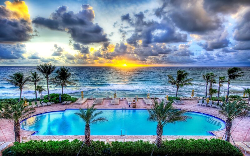 Sunset at beach resort pool