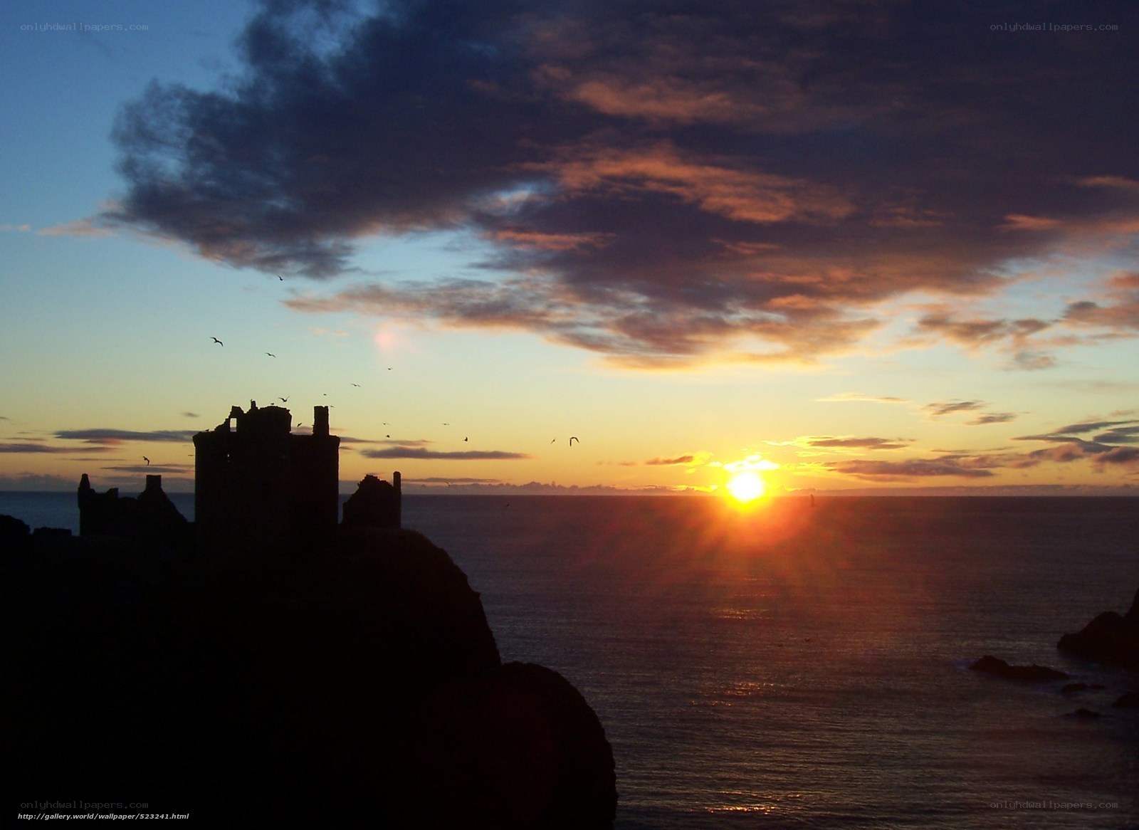 Sunset at coastal castle ruins