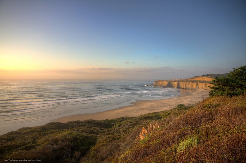 sunset at coastal cliff beach