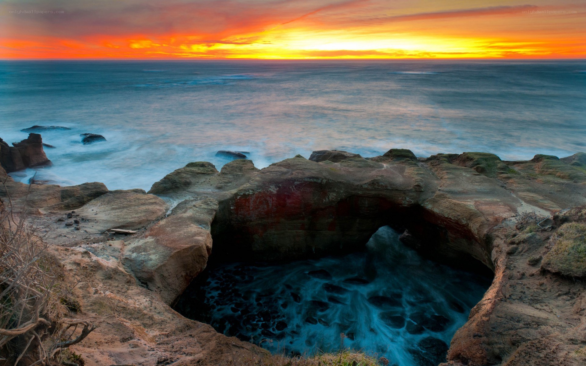 Sunset at coastal rock arch
