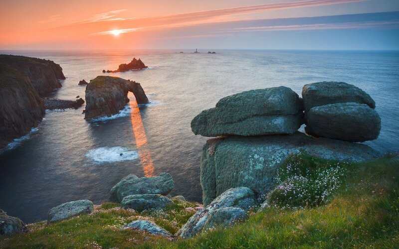 Sunset at coastal rock arch