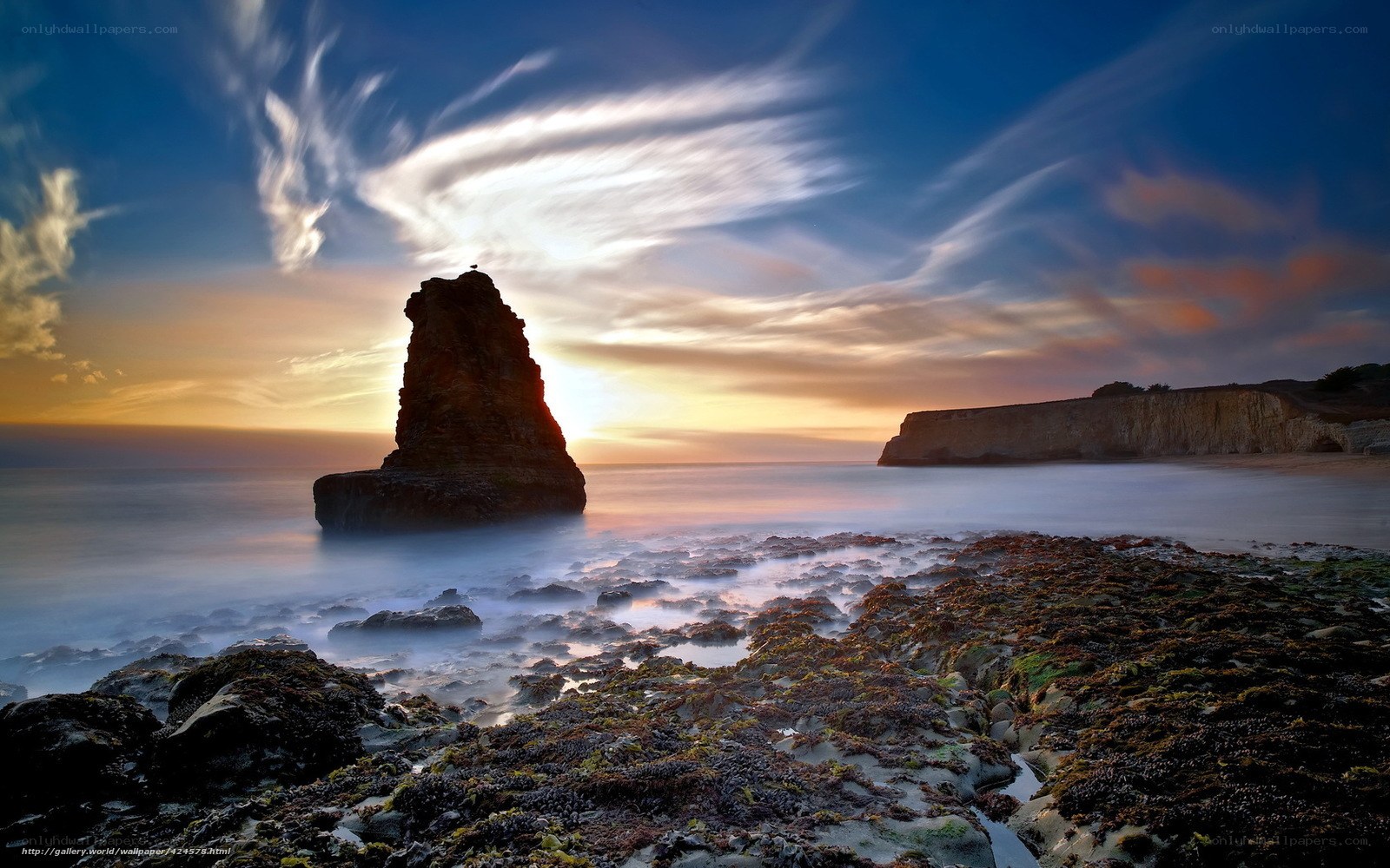 Sunset at coastal rock formation