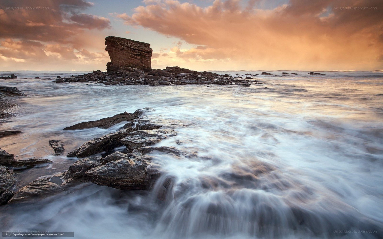 Sunset at coastal rock formation