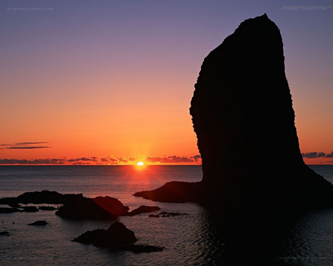 Sunset at coastal rock formation