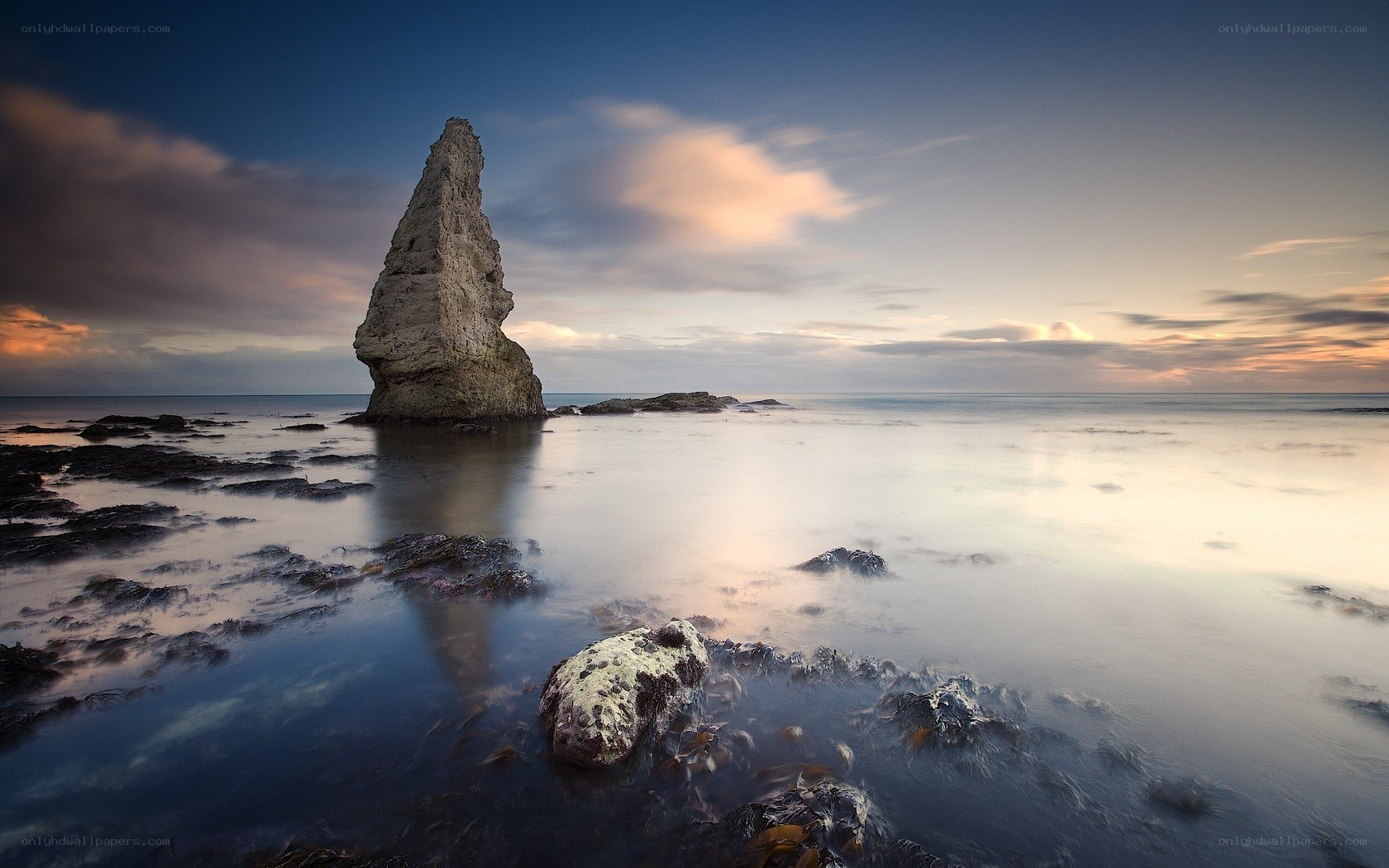 Sunset at coastal rock formation