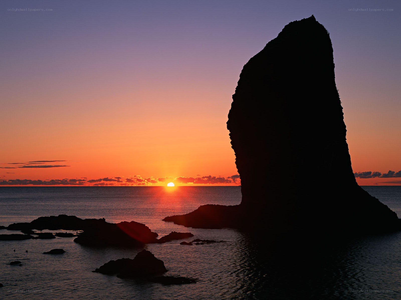 Sunset at coastal rock formation