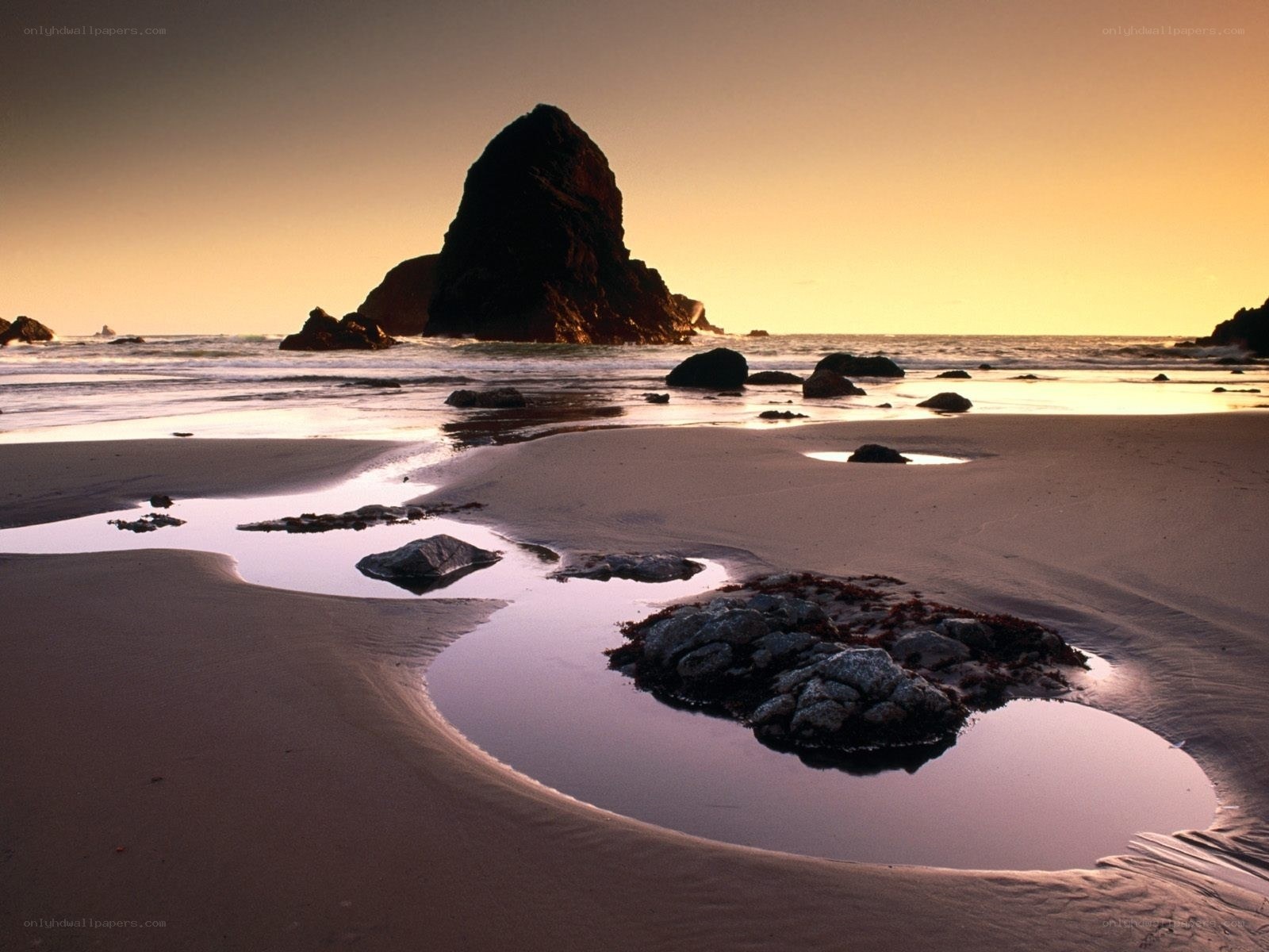 Sunset at coastal rock formation