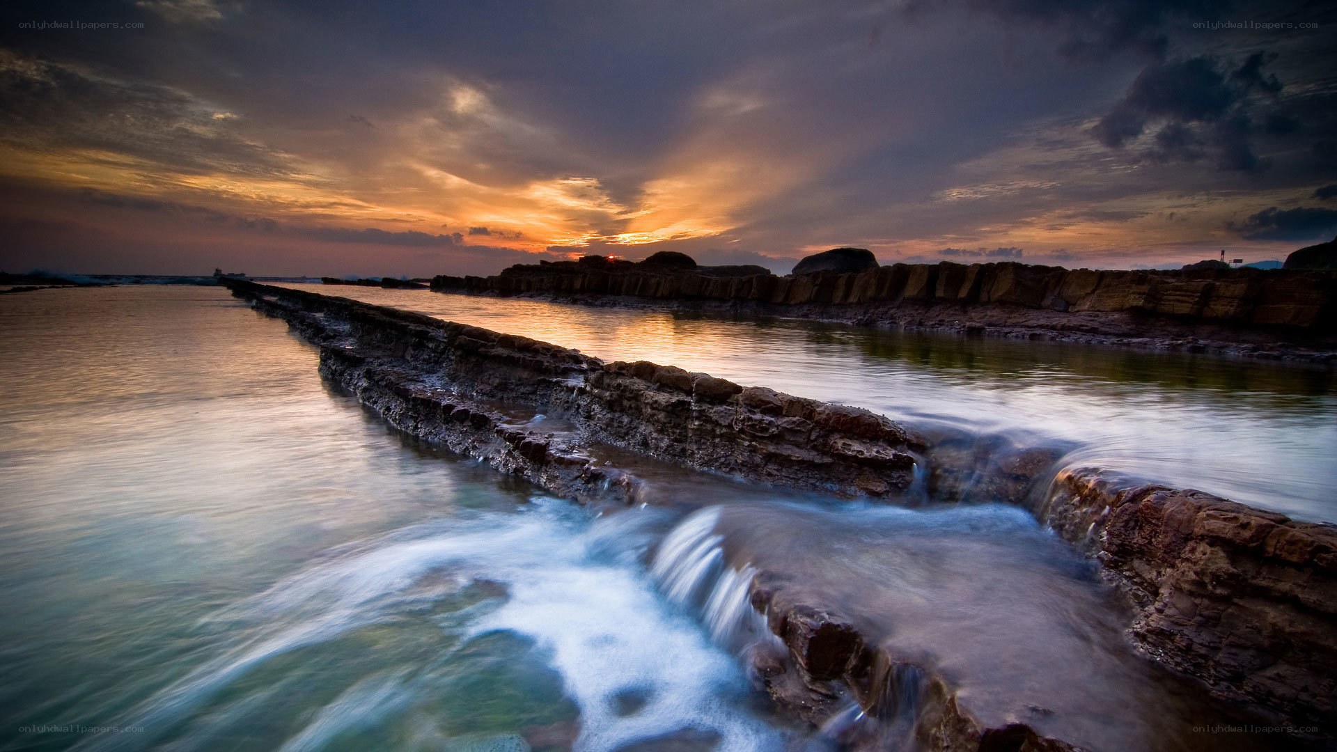 Sunset at coastal rock formations