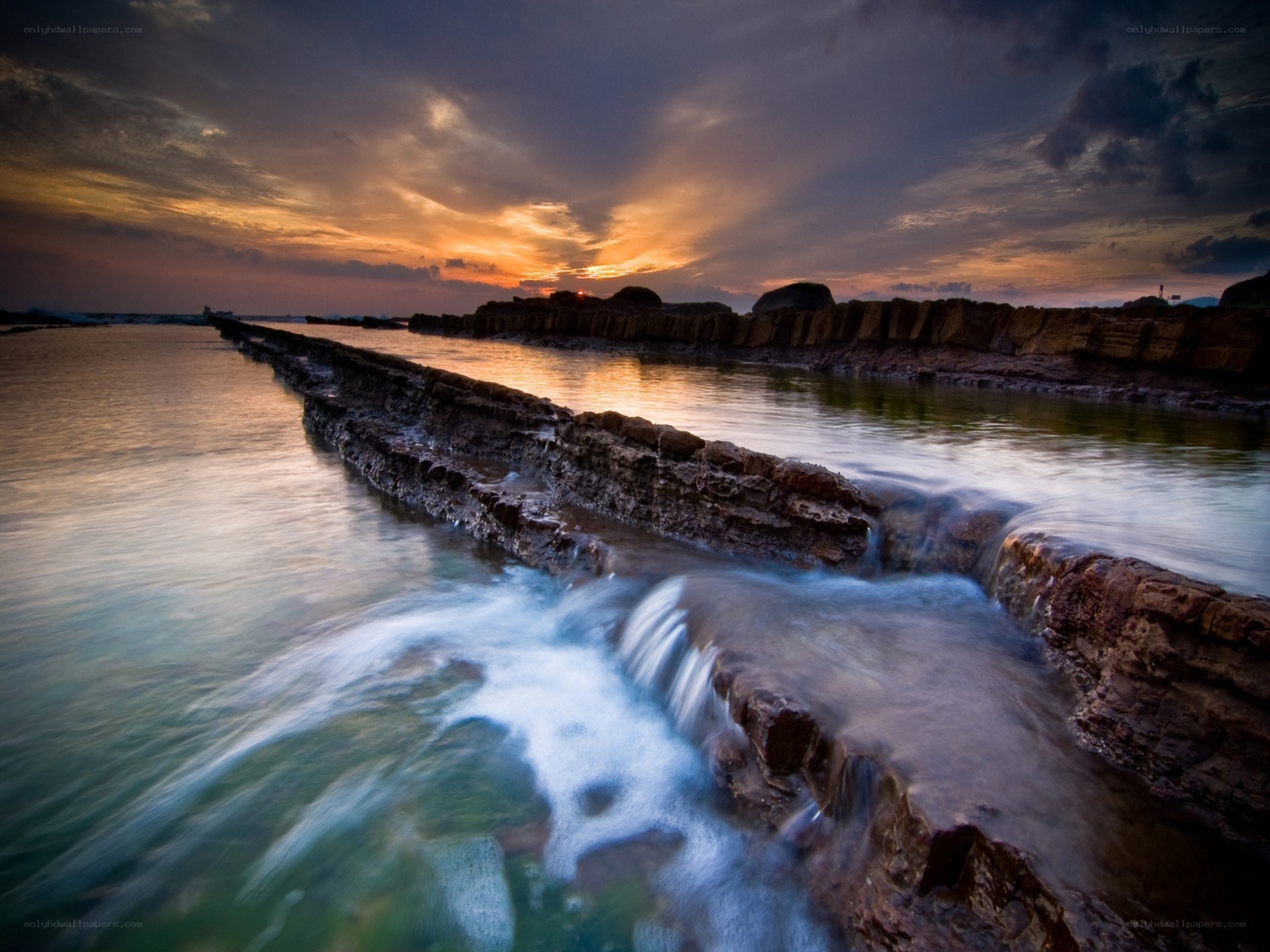 Sunset at coastal rock formations