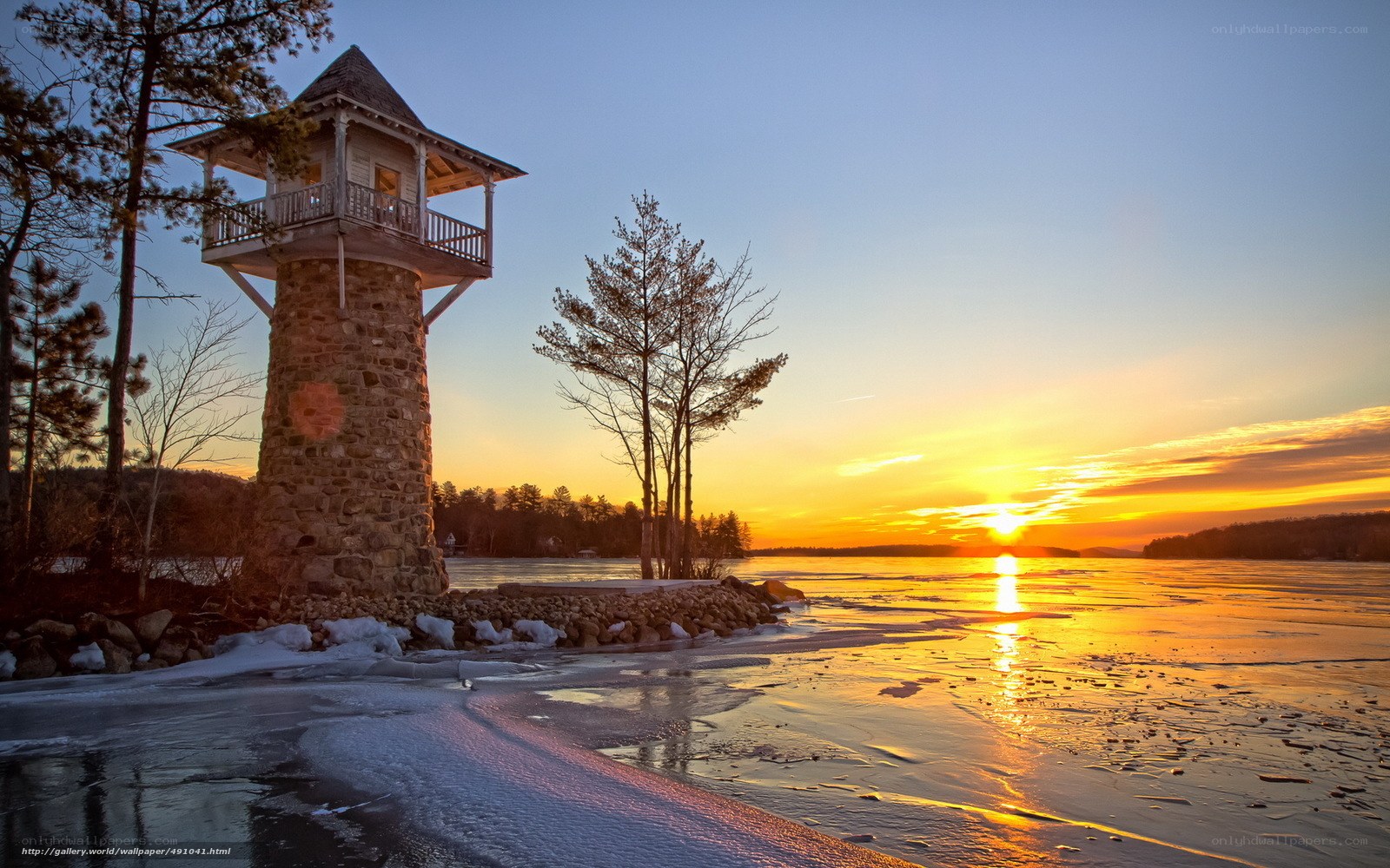 Sunset at frozen lake tower