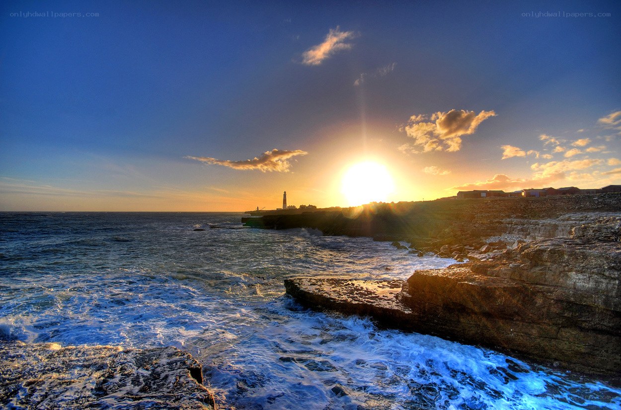 Sunset at lighthouse coast