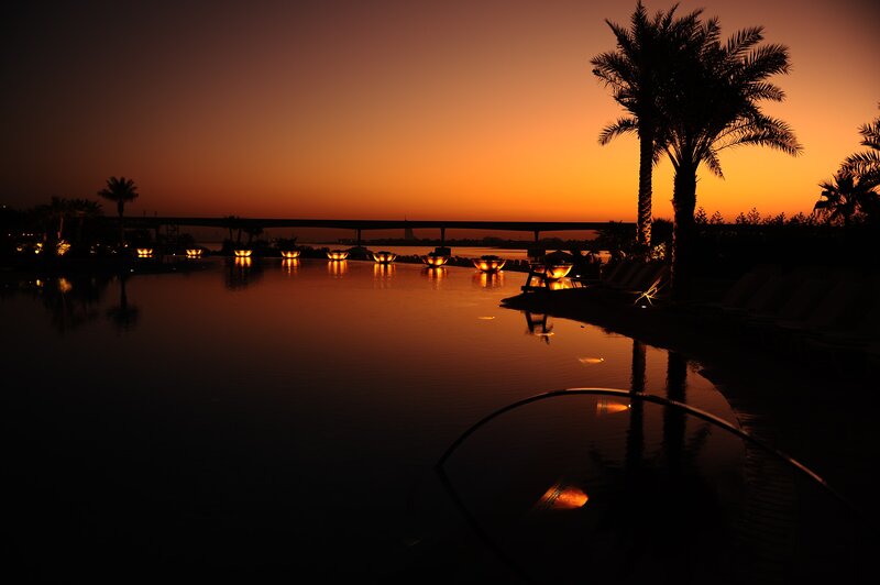 sunset at resort pool