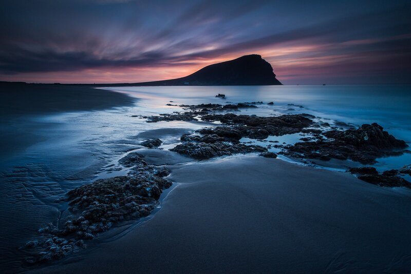 Sunset at rocky beach