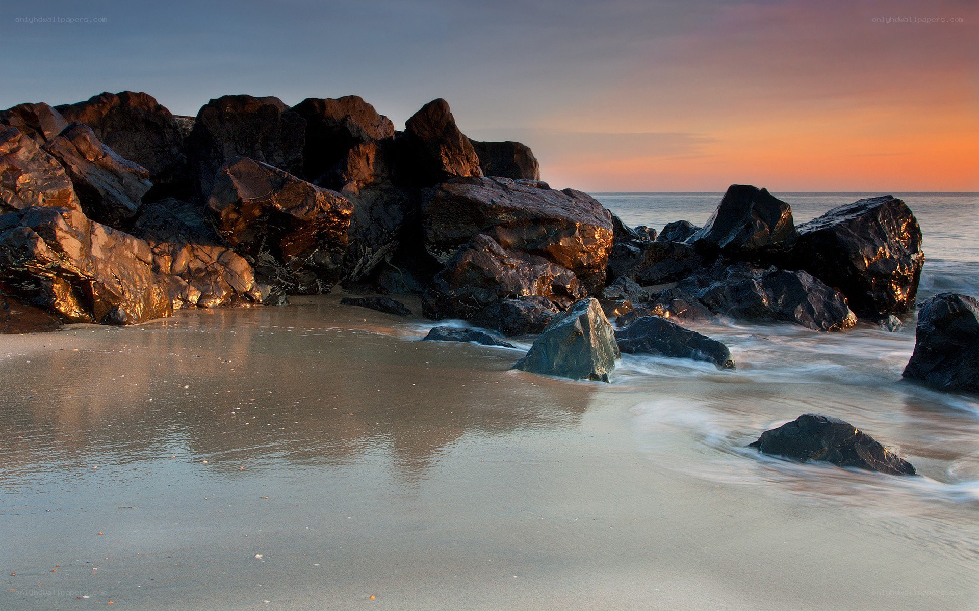 Sunset at rocky beach