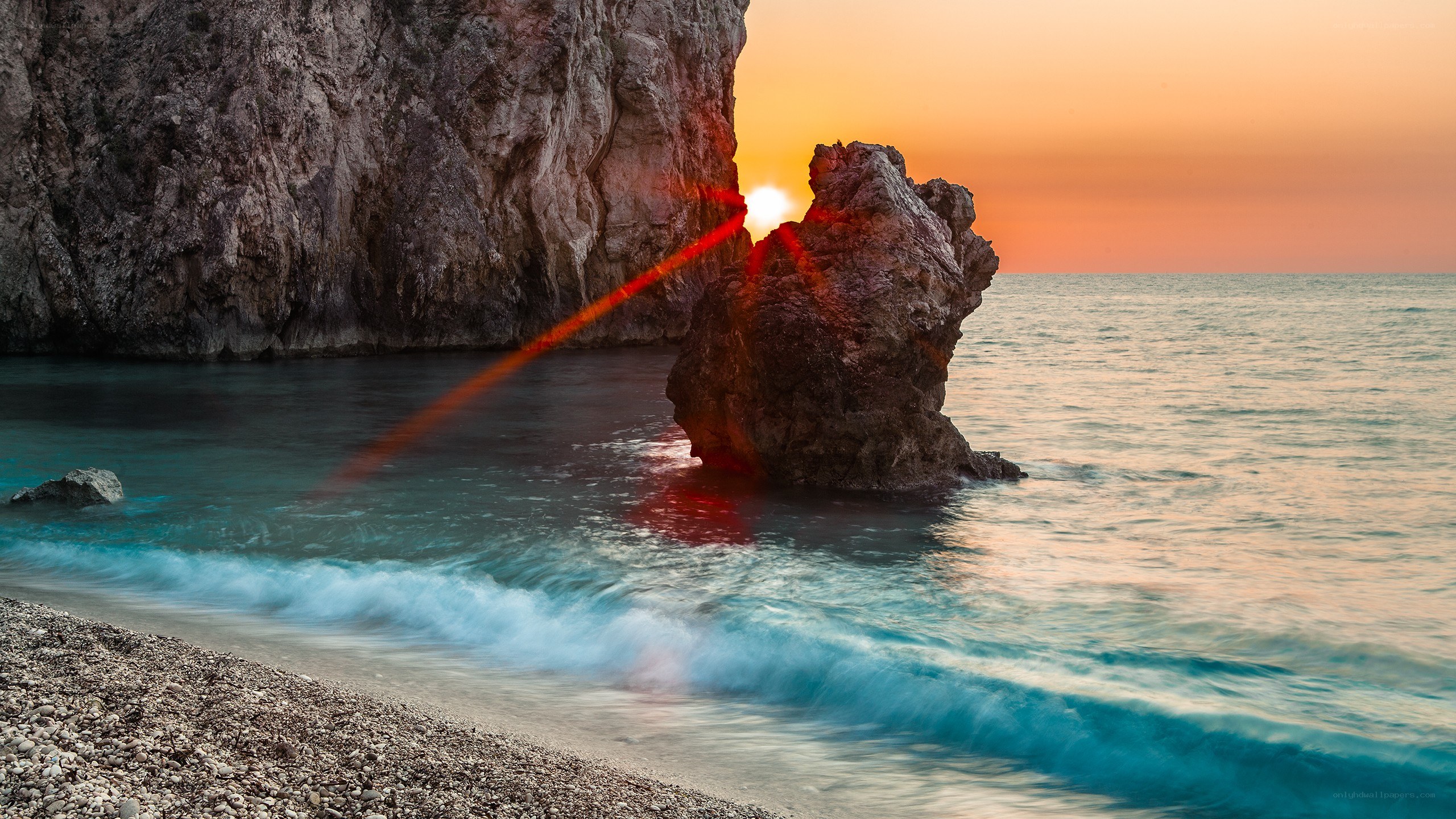 Sunset at rocky beach