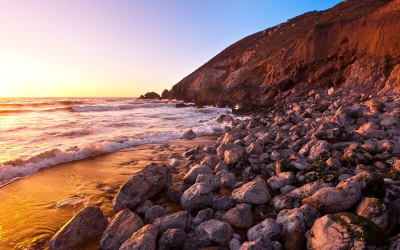 Sunset at rocky beach