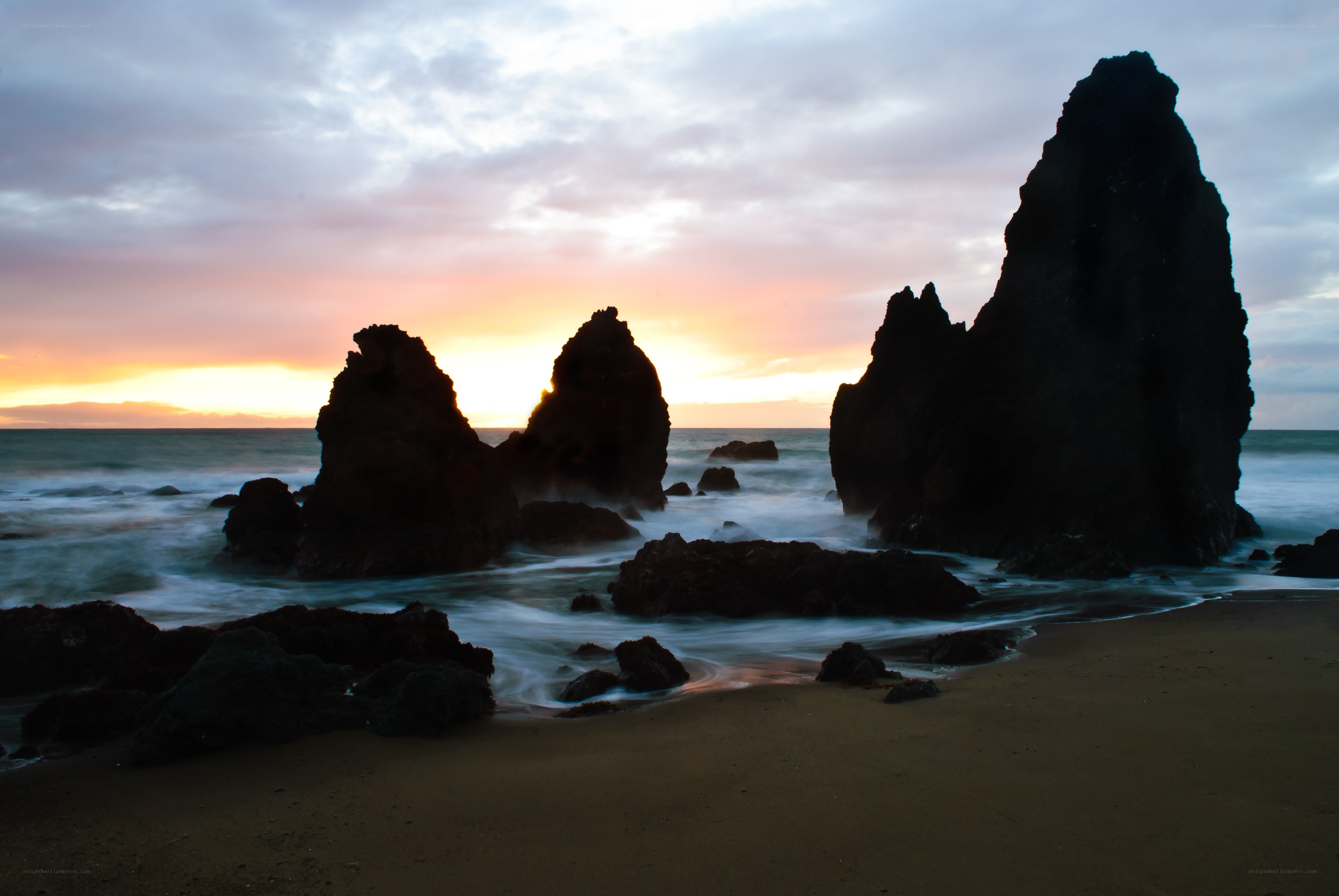 Sunset at rocky beach