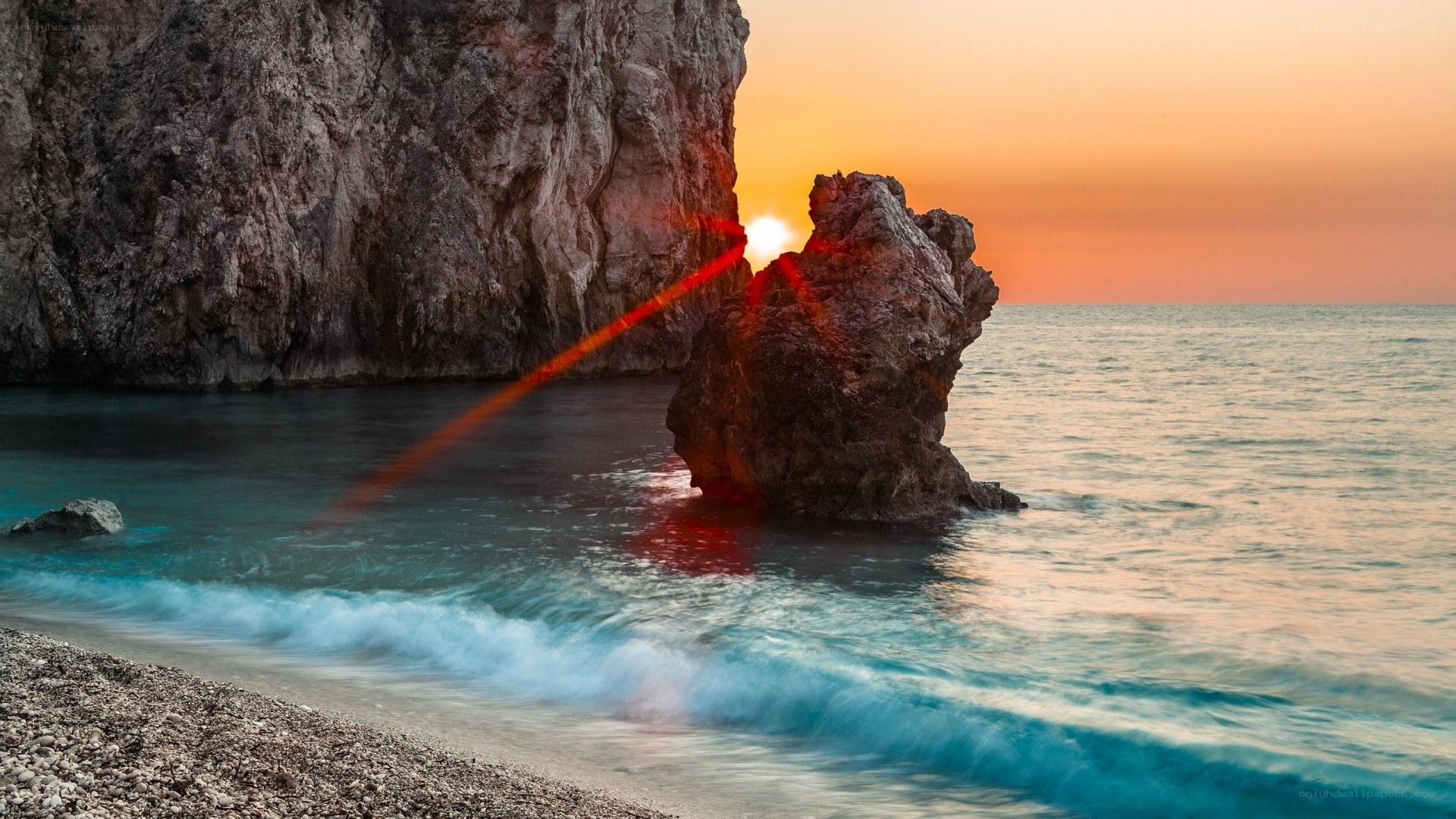 Sunset at rocky beach