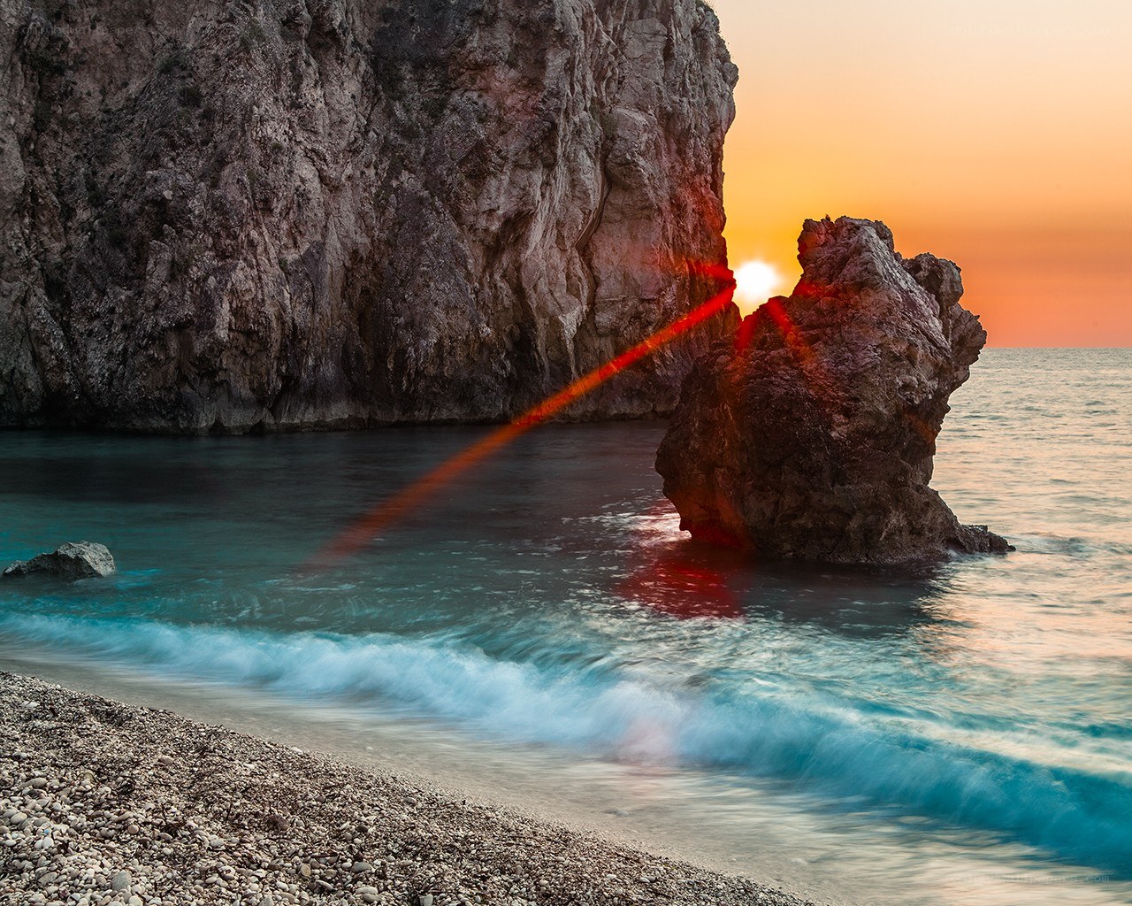Sunset at rocky beach