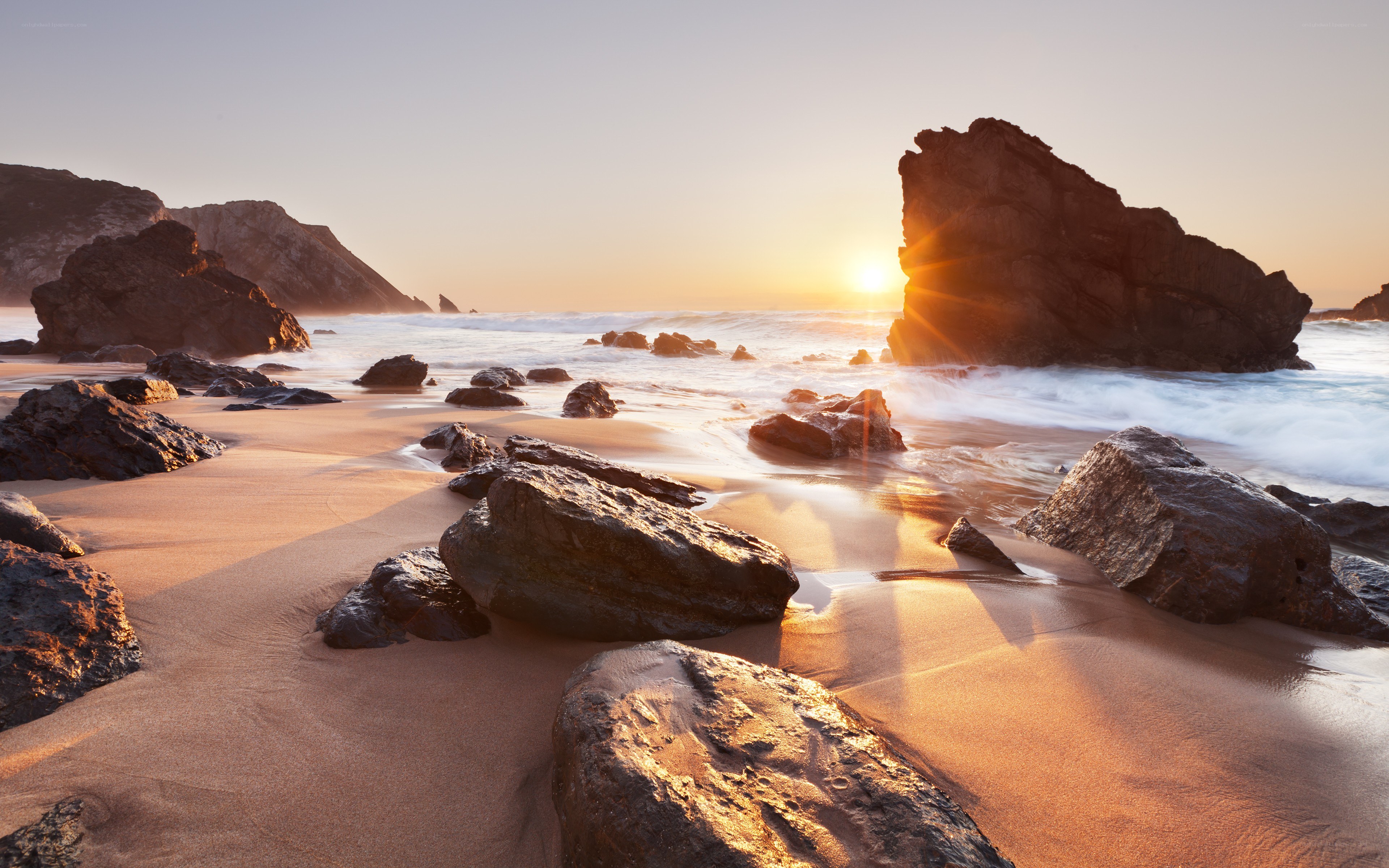 Sunset at rocky beach