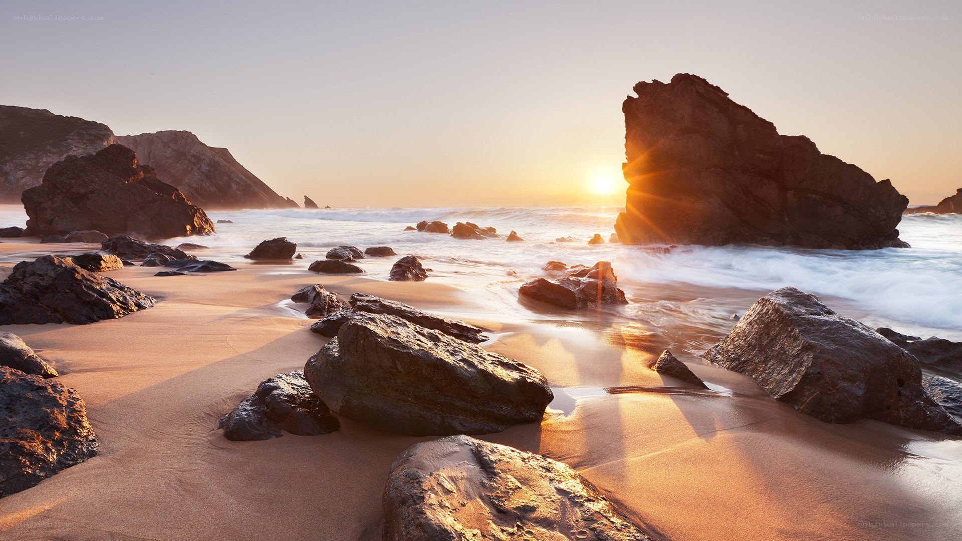Sunset at rocky beach