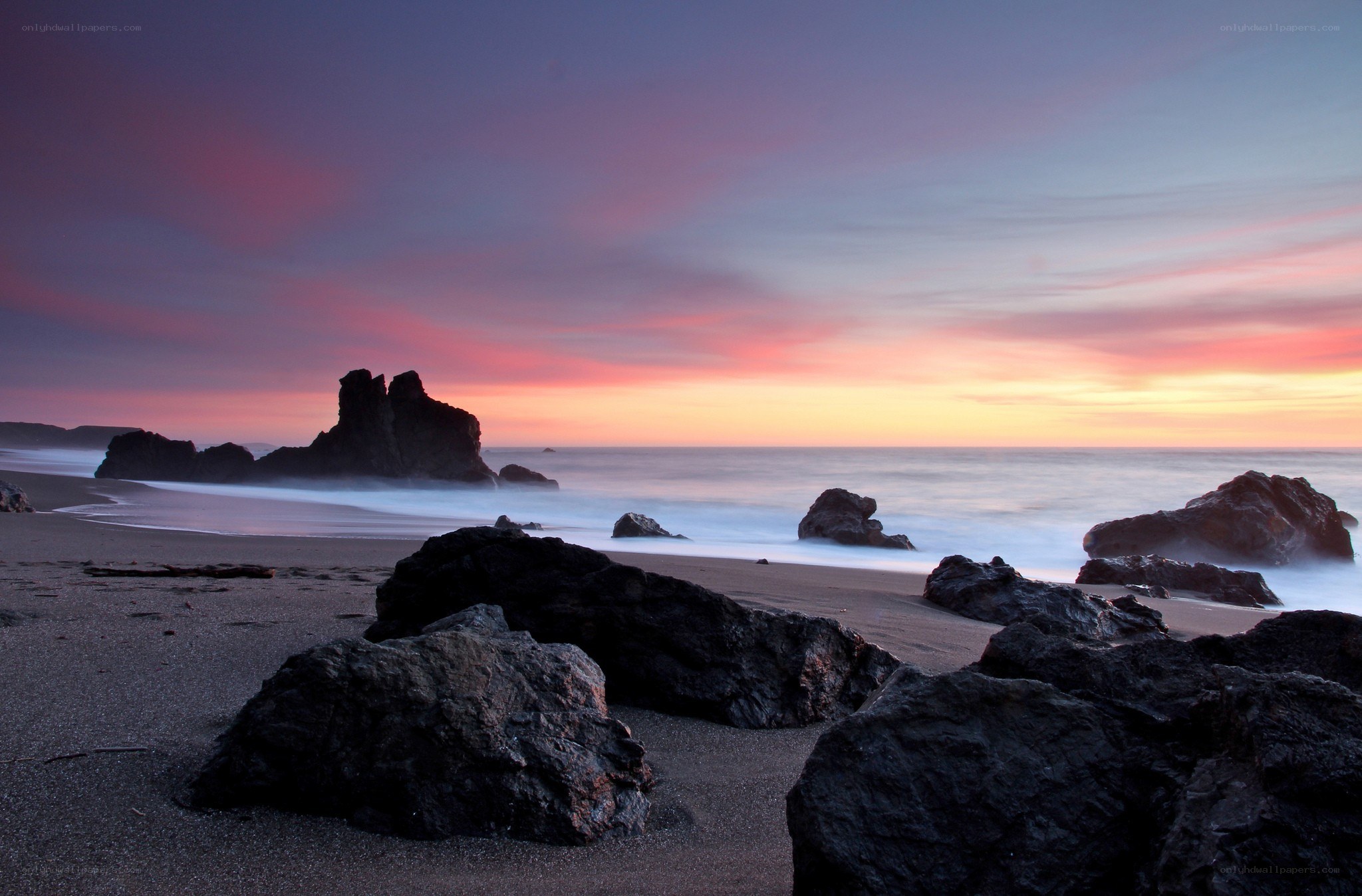 Sunset at rocky beach