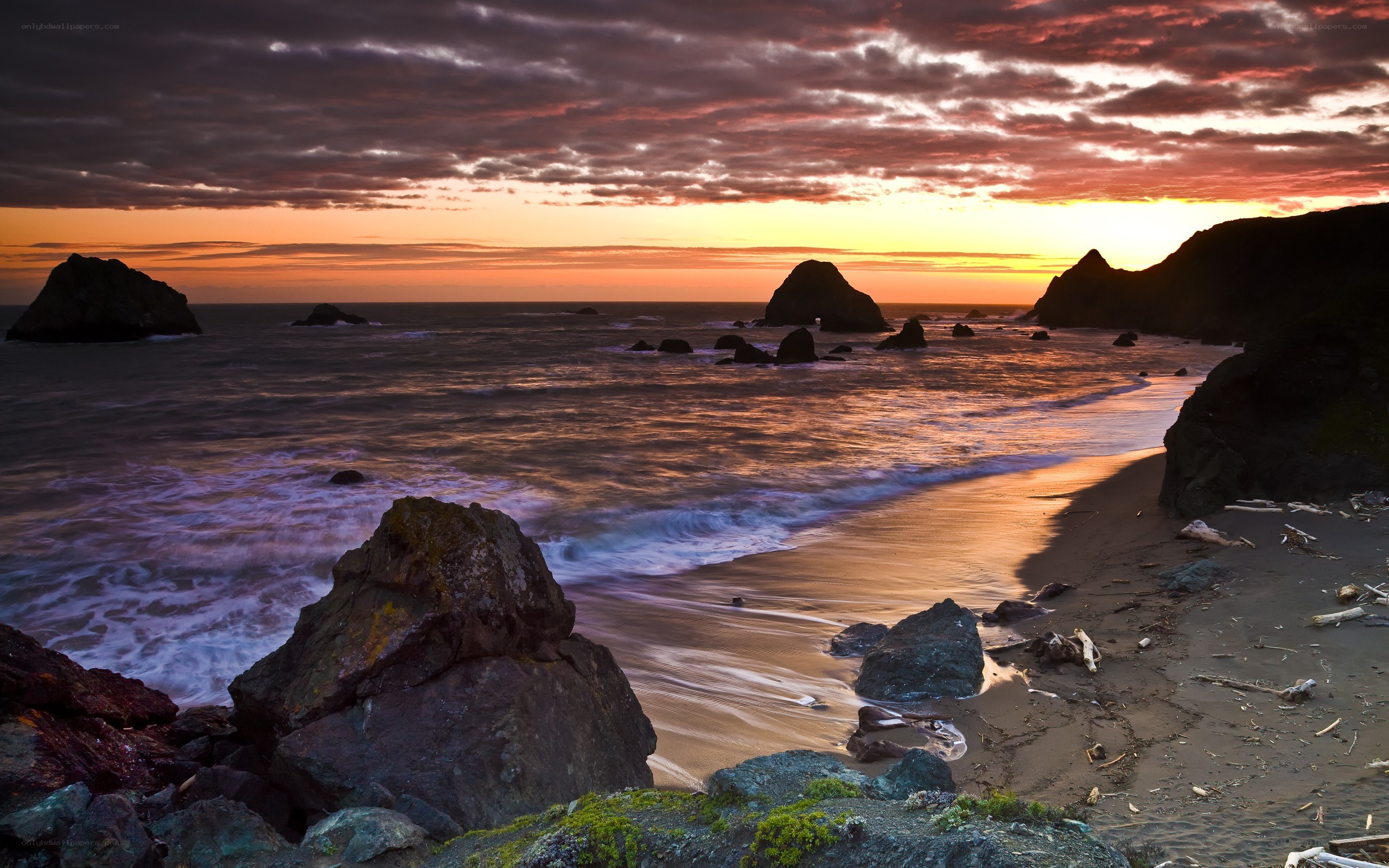 Sunset at rocky beach
