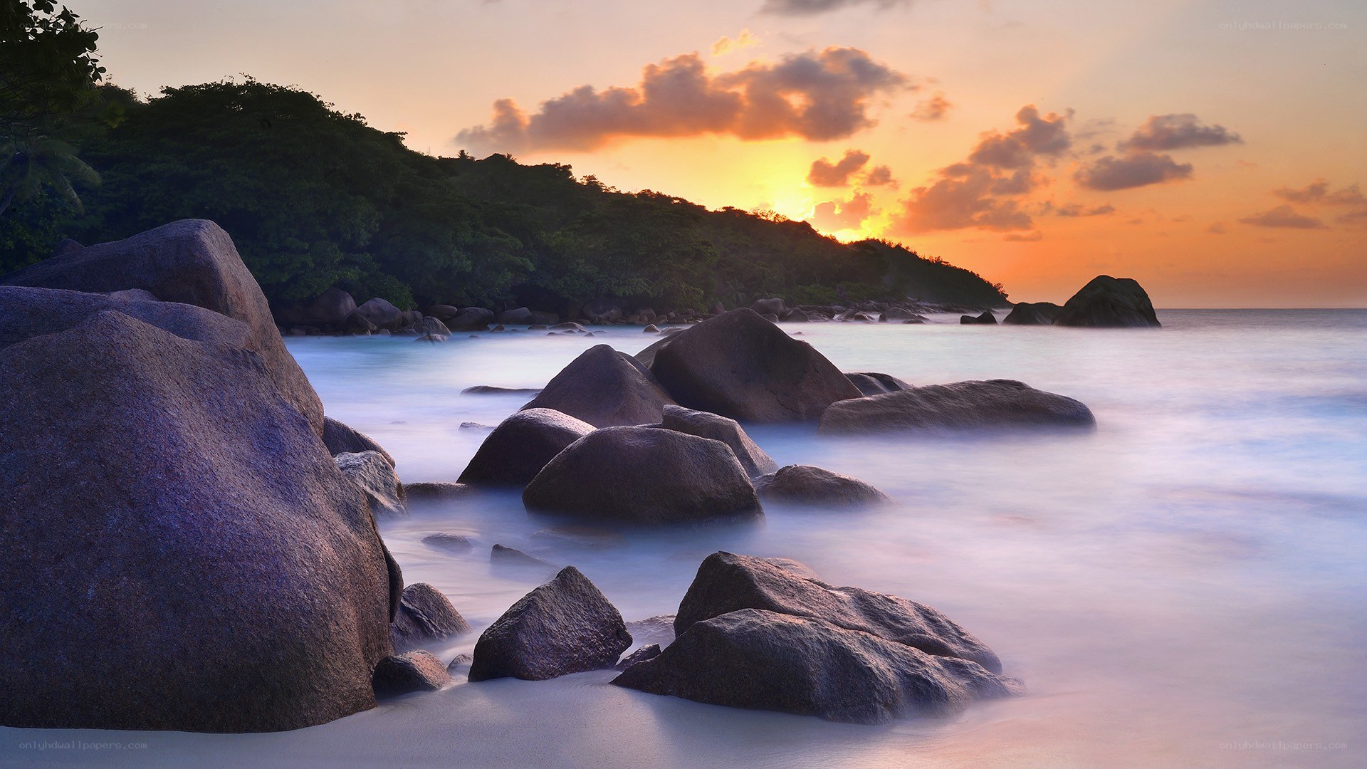 Sunset at rocky beach
