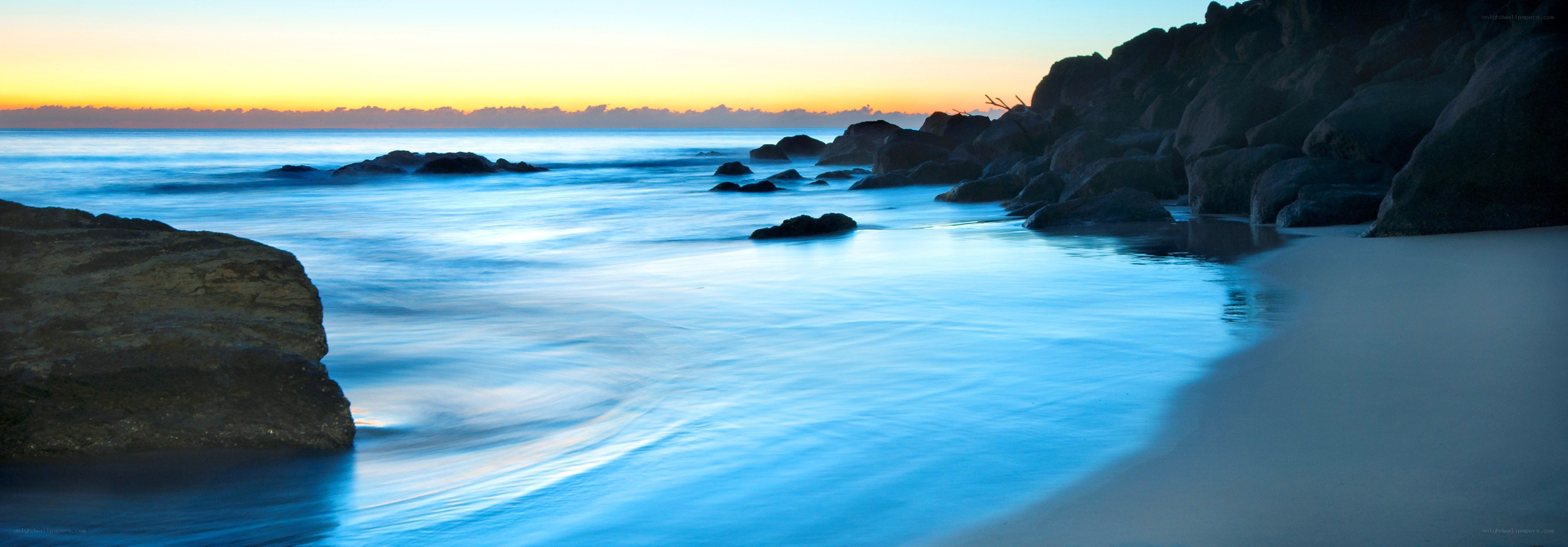 Sunset at rocky beach
