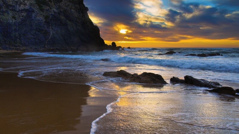 Sunset at rocky beach