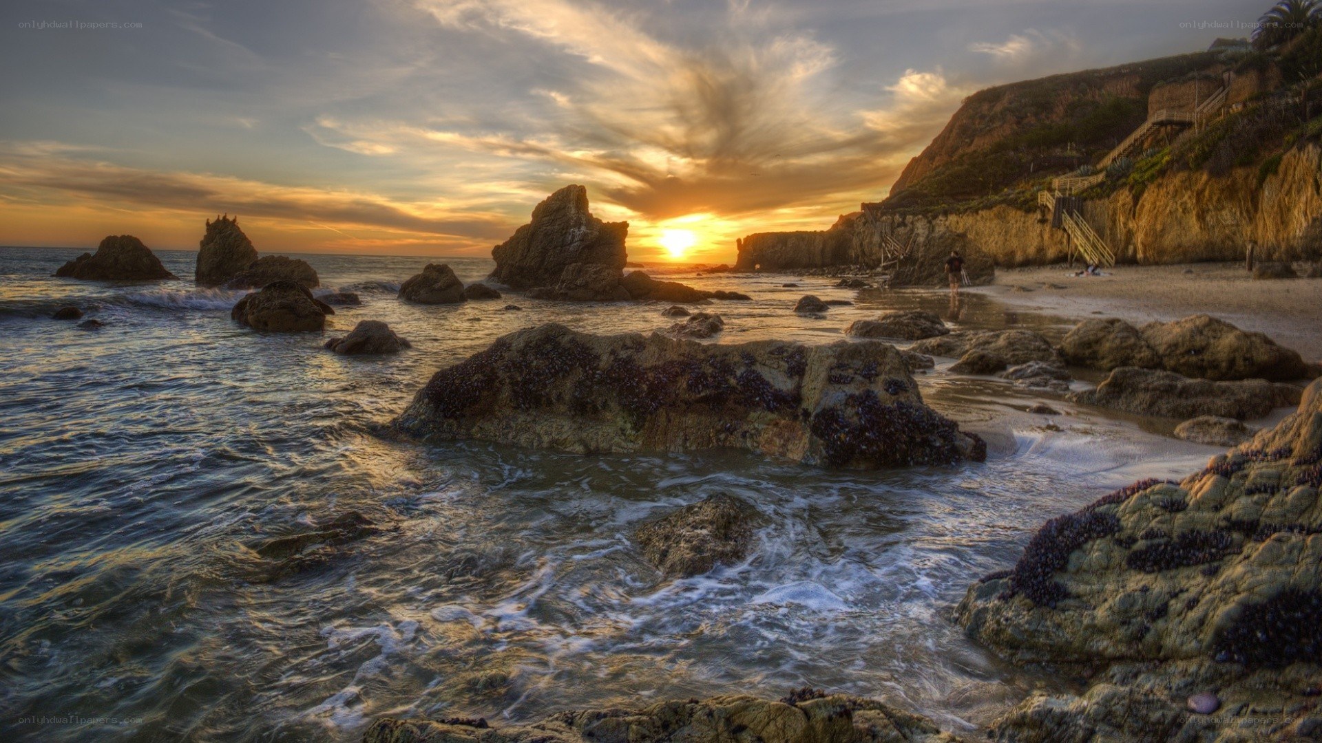 Sunset at rocky beach