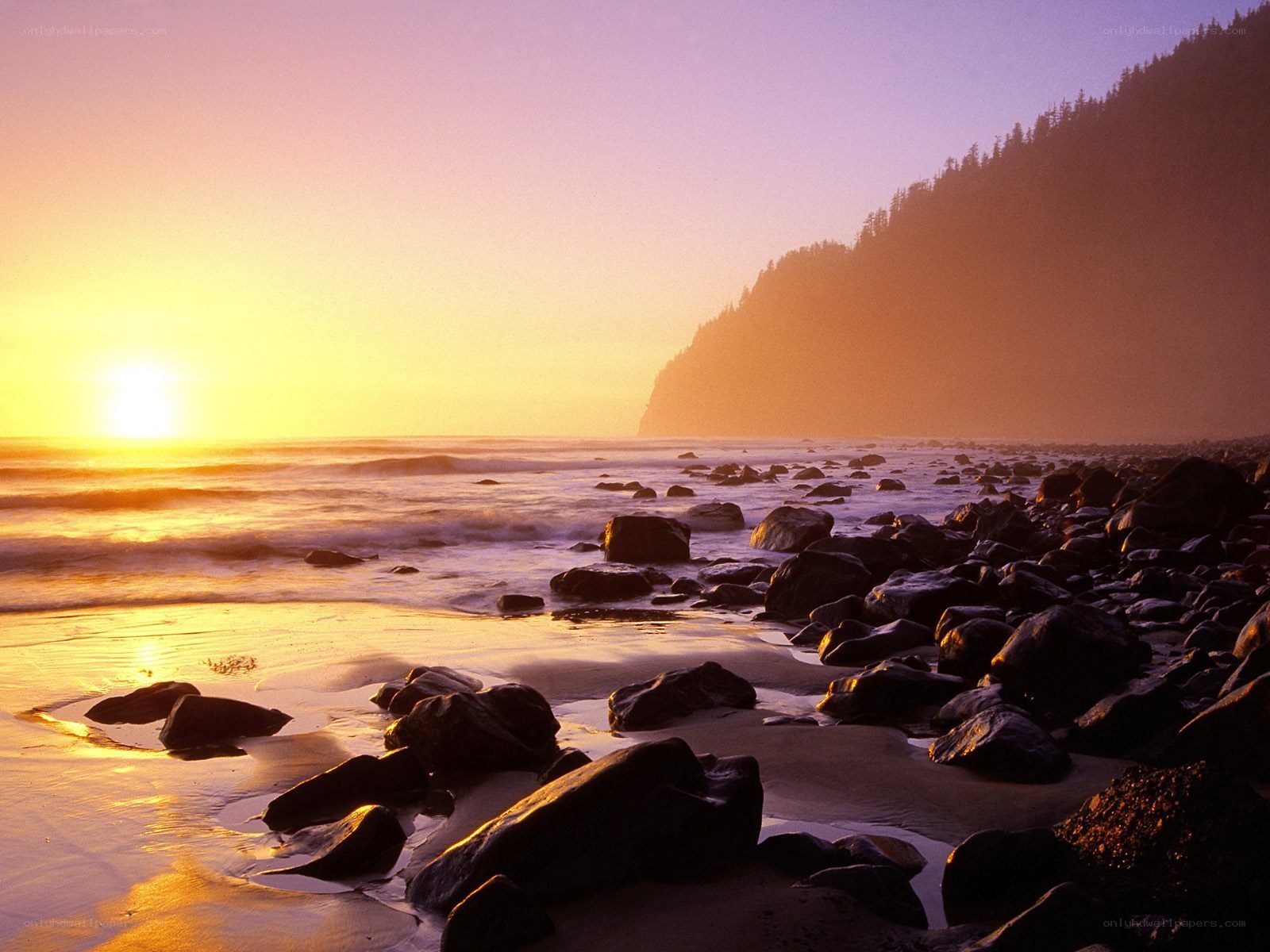 Sunset at rocky beach