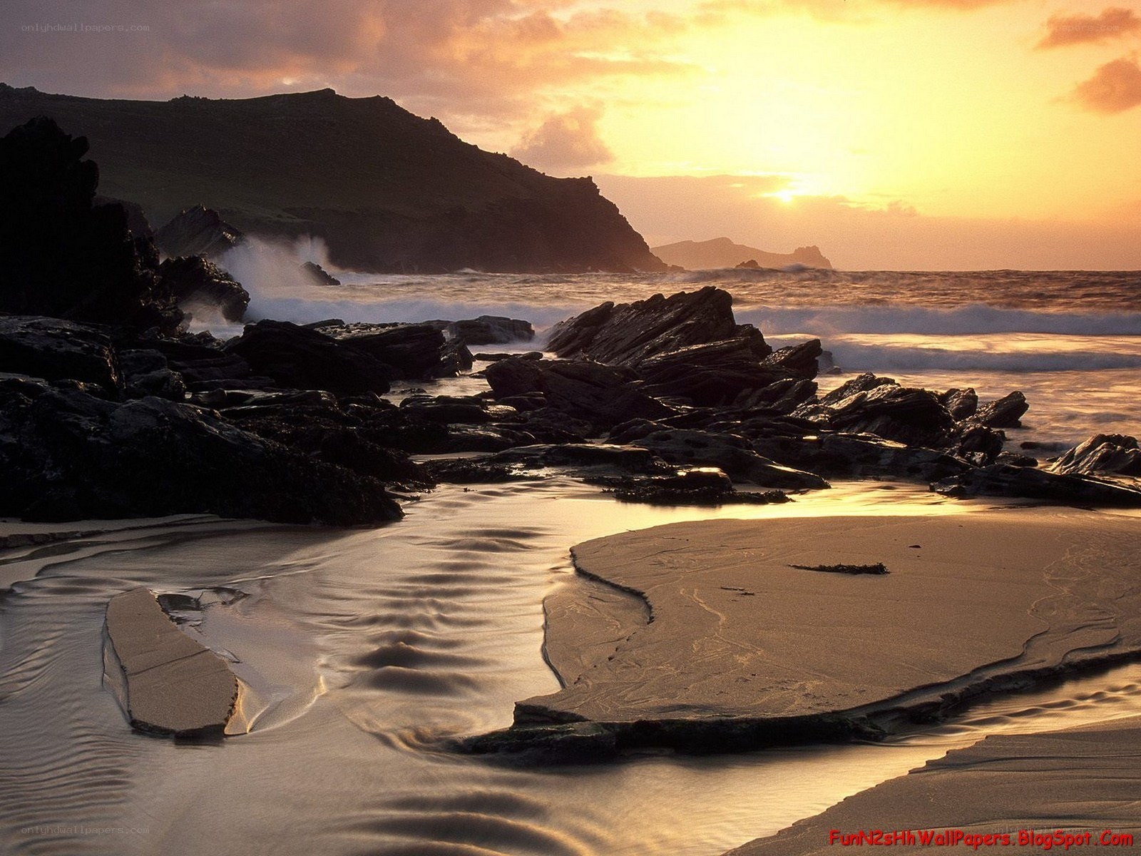 Sunset at rocky beach