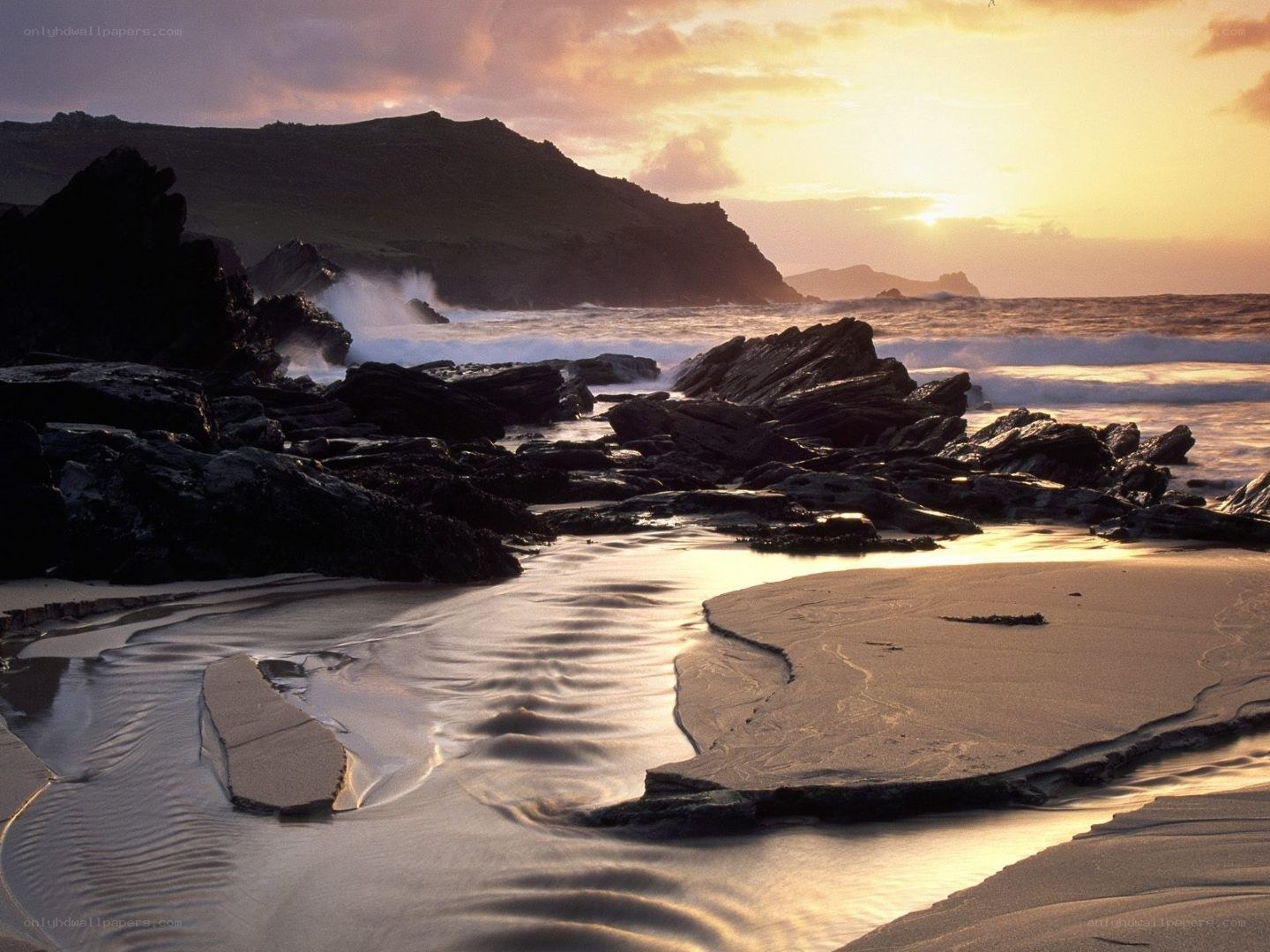 Sunset at rocky beach