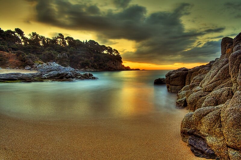 Sunset at rocky beach