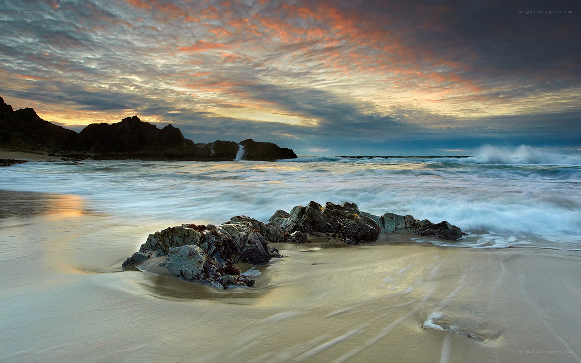 Sunset at rocky beach