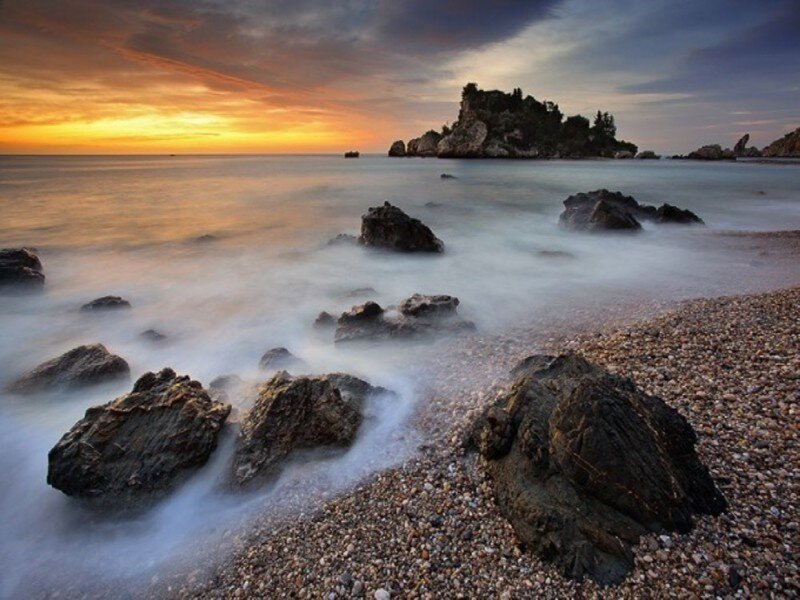 Sunset at rocky beach