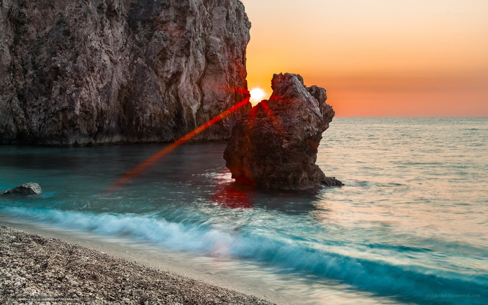 Sunset at rocky beach