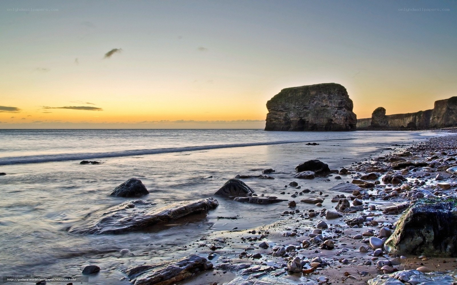 Sunset at rocky beach
