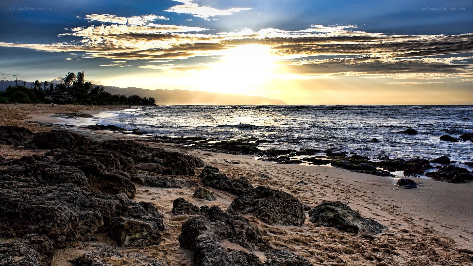 Sunset at rocky beach