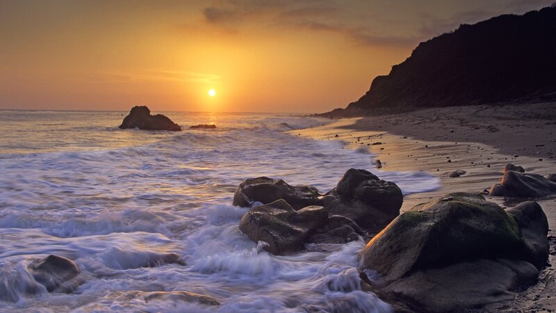 Sunset at rocky beach