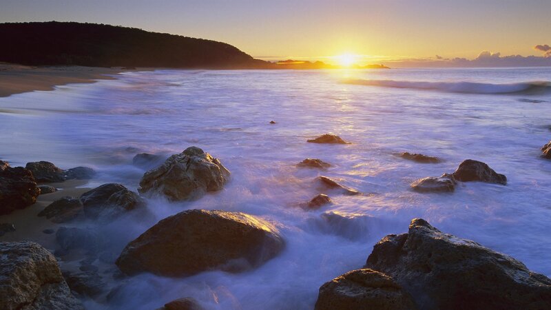 Sunset at rocky beach