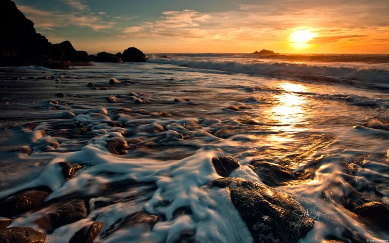 Sunset at rocky beach