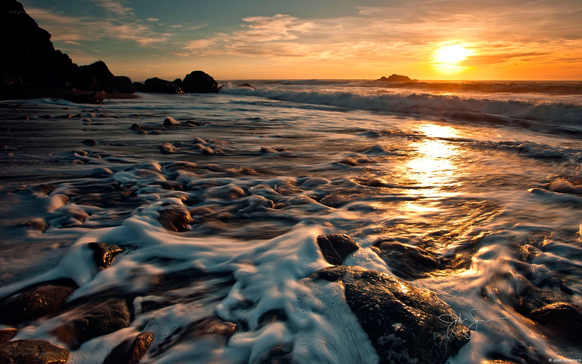 Sunset at rocky beach