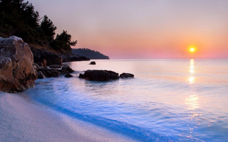 Sunset at Rocky Beach — Orange, Serene, Photograph, Sun, Sea